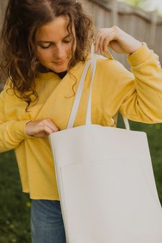 A classic leather tote is a wardrobe staple every girl needs in their life. And these beauties are here in our fun new colours to add a pop of color to your wardrobe! Its buttery soft leather and minimalistic yet functional design makes this a bag that will fit seamlessly into your life. Whether it’s tagging along for a weekend trip to the farmer’s market, holding all your work or school necessities, or traveling with you around the world, you’ll find this beautiful genuine leather tote the bag School Necessities, Classic Leather Tote, Genuine Leather Totes, The Farmer, Girl Needs, Weekend Trip, Classic Leather, Every Girl, Functional Design