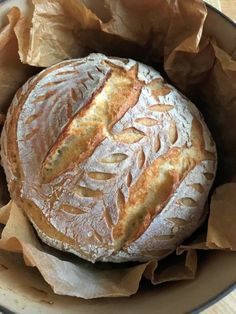 a loaf of bread sitting inside of a bowl