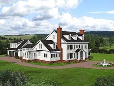 an artist's rendering of a large white house in the middle of a lush green field