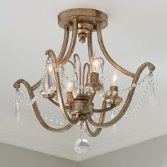 a chandelier hanging from the ceiling in a room