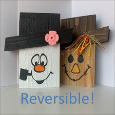 two wooden blocks with faces painted on them and the words reversible written below