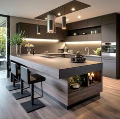 a modern kitchen with an island in the middle