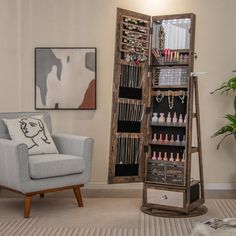 a living room with a chair and a jewelry rack in the corner next to a plant