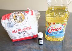 an all - purpose flour, oil and vinegar are on the table next to each other