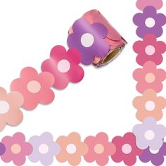 a roll of pink and purple paper with polka dots on it