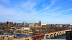 an old bridge over a river in the city