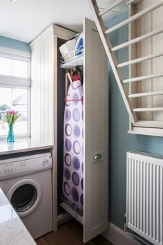 a washer and dryer in a small room