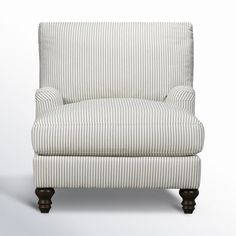 a striped chair sitting on top of a white floor