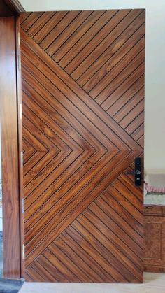 a wooden door with an interesting pattern on it