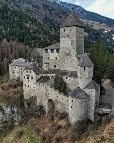 an old castle in the middle of a mountain