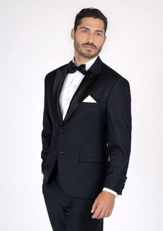 Look your best in the Dean Dark Navy Twill Tuxedo. This timeless design exudes sophistication and elegance for any formal occasion. Crafted from luxurious twill fabric, the dark navy shade adds an air of subtle class and exclusivity. Be the envy of the night in this classic, tailor-made piece. Elegant Tuxedo For Wedding Gala, Elegant Wedding Tuxedo For Gala, Elegant Wedding Tuxedo With Custom Fit, Elegant Notch Lapel Tuxedo For Gala, Elegant Tailored Tuxedo For Gala, Elegant Suits For Black-tie Gala Events, Elegant Fitted Tuxedo For Black Tie Events, Classic Fitted Suit For Gala, Elegant Notch Lapel Suits For Gala