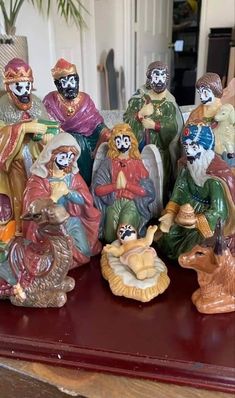 a group of figurines sitting on top of a table