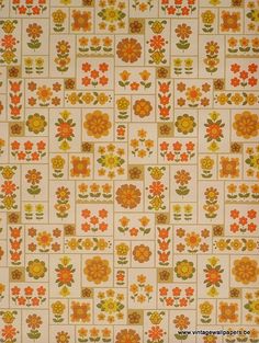 an orange and yellow flowered pattern on a white wallpaper with brown, green, red, and yellow flowers