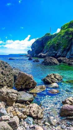 the water is crystal blue and clear with rocks