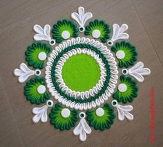 a green and white circular design on the floor