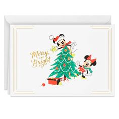 a christmas card with mickey and minnie in front of a tree that says merry and bright