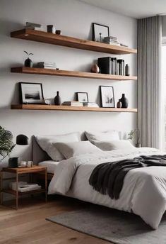 a bed sitting in a bedroom next to a window with lots of shelves on it