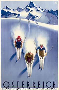 three skiers skiing down a snow covered mountain