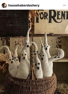 a group of stuffed animals sitting in a basket