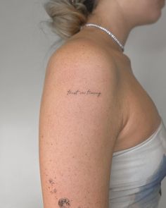 a woman with a tattoo on her arm that says, i love you mommy and the stars are in the sky