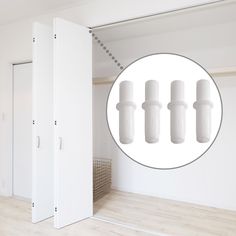 an open closet with four doors and three white cylindrical cylinders on the wall next to each other