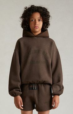 The Kids Fear of God Essentials Heather Wood Nylon Fleece Hoodie features a relaxed fit, long sleeves, a contrast nylon attached hood, a bold "ESSENTIALS" soft-touch rubberized logo on the front, and a rubber brand logo on the upper back. 


	Stretch nylon and core fleece fabric
	Attached hood
	Long sleeves
	Dropped shoulders
	Soft-touch rubberized logo
	Side hand pockets
	Rubber brand label
	Contrast stretch binding
	Relaxed fit
	86% nylon, 14% spandex; Contrast: 80% cotton, 20% polyester brushed back fleece
	Hand wash, flat or line dry


Fear of God Essentials are final sale and may not be returned, modified, or exchanged due to high demand. This supersedes all other PacSun return policies. Fear Of God Essentials, Hoodie Brands, Brand Label, Fear Of God, Fleece Hoodie, Fleece Fabric, Pacsun, Drop Shoulder, Kids Hoodie