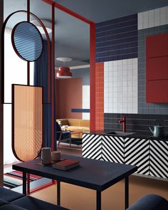 a kitchen with red, white and blue tiles on the wall next to a sink