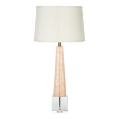 a table lamp with a white shade on it