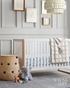 a baby crib with a stuffed animal next to it