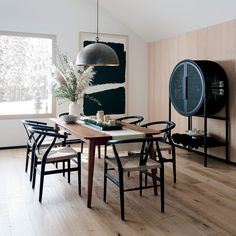 a dining room with wooden floors and walls