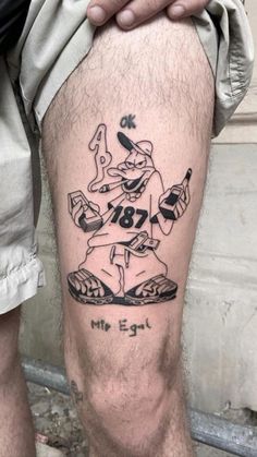 a man with a tattoo on his leg that says, mr eglil and is holding a baseball bat