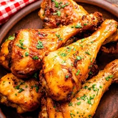 grilled chicken wings in a wooden bowl with parsley on the side, ready to be eaten