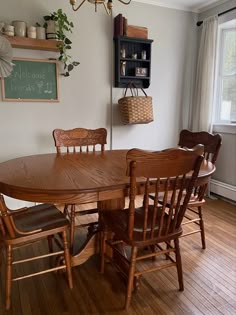 a wooden table and chairs in a room