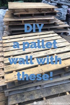 some pallets stacked up with the words diy a pallet wall with these