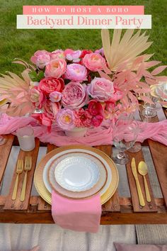 the table is set with pink flowers and place settings for an outdoor dinner party or brunch