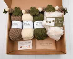 yarn and knitting supplies in a cardboard box