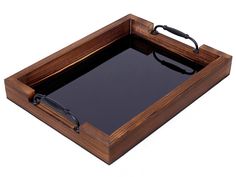 a wooden tray with black glass in the center and handles on each side for serving food