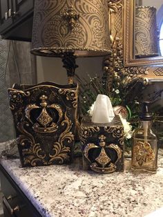 decorative items are sitting on a marble counter top