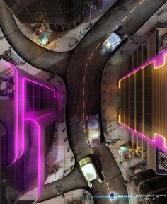 an aerial view of cars driving down a city street with neon lights on the buildings