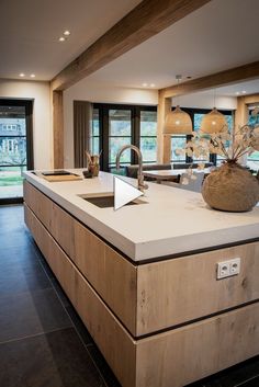 a large kitchen with an island counter top