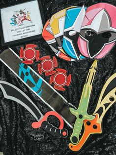 some scissors and other items are laying out on a black surface with a plaque in the middle