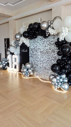 a room decorated with balloons and numbers