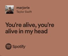 an ad for spotify with the caption you're alive, you're alive in my head