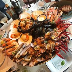 a platter filled with seafood and other foods