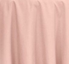 a pink table cloth on top of a wooden table