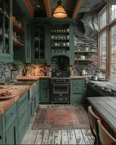 an old fashioned kitchen with green cabinets and wood flooring is pictured in this image