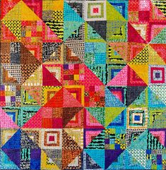 a colorful quilt with many different colored squares on it's sides and one square in the center