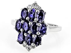 1.80ctw Oval Iolite With 0.28ctw Round White Zircon Rhodium Over Sterling Silver Ring. Measures Approximately 0.81"L x 0.52"W. Not sizeable.  Accent stones primarily zircon. Sterling Silver Ring, Silver Ring, Sterling Silver Rings, Silver Rings, Sterling Silver, Ring, Stone, Purple, Silver