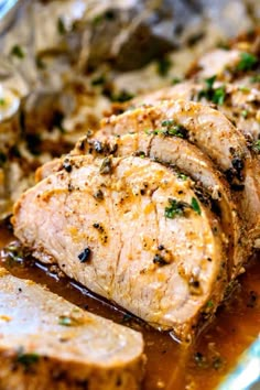 sliced pork chops with gravy on a plate