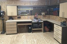 a workbench with lots of drawers and tools on the counter in front of it